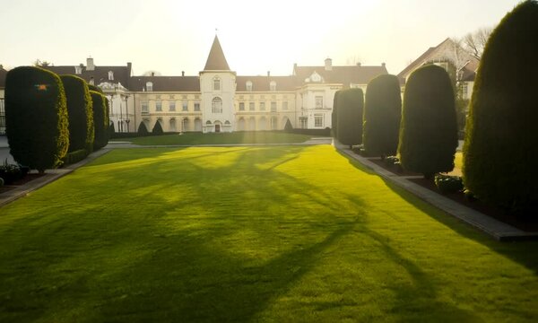 Green lawn with large courtyard at the morning sun