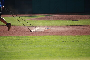 Dragging baseball infield, sports field dust