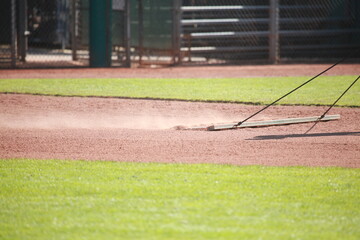 Dragging baseball infield, sports field dust