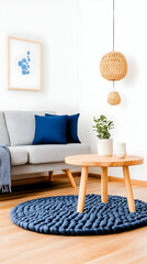 Modern living room corner with light grey sofa, blue rug, and wooden coffee table