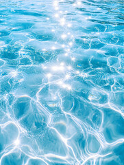 Obraz premium Sparkling blue water surface with light reflections