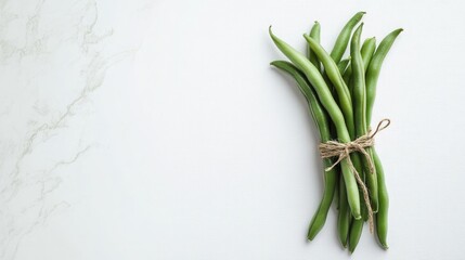 Obraz premium A fresh pod of green beans tied delicately with a natural string