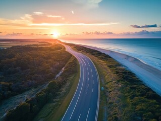 Aerial coastal highway at sunset with drone perspective and negative space on left
