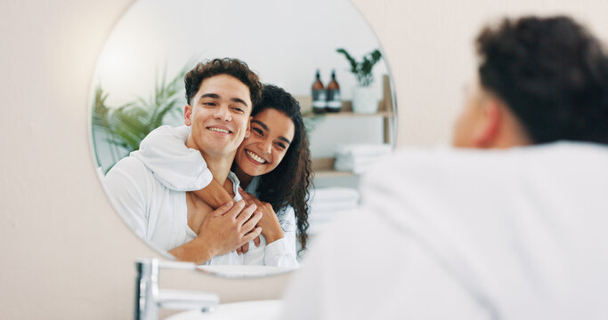Happy couple, mirror and bathroom with hug for morning routine, hygiene or skincare together at home. Man, woman or lovers with smile, reflection or embrace for grooming, love or spa day at house
