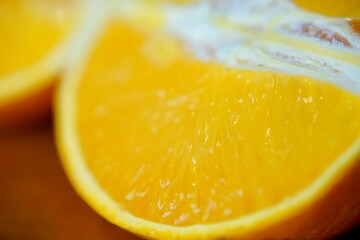 Fresh slice of orange close-up on white background, vibrant and juicy fruit, concept of healthy eating, beverages, fruits, nutrition.