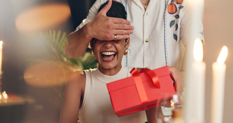 Couple, surprise and gift with box at restaurant for valentines day, romantic present and...
