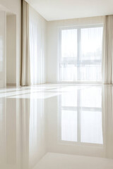 New modern epoxy glossy poured floor in the interior of the apartment
