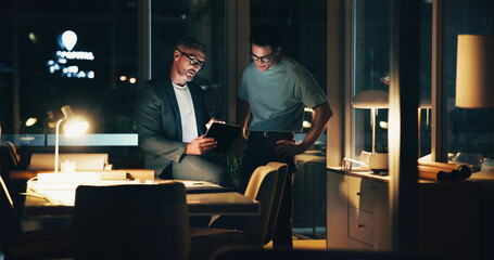 Architecture, night and men in office for feedback, urban planning and property design or floorplan. Creative agency, working late and architect with layout, blueprint and ideas for building project