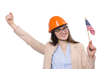 A girl in a construction helmet and an American flag stands happy on a white background.