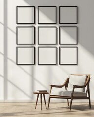 Nine blank frames on wall, armchair, side table.