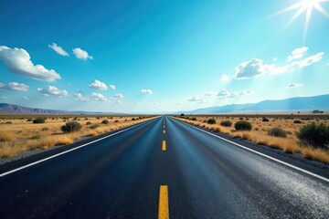 Naklejka premium Dark asphalt ribbon stretches to horizon under vast blue sky, clear sky, blue sky