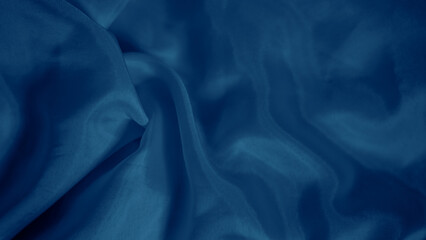 Elegant blue silk fabric draped gracefully with a soft iridescent shine.