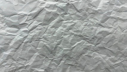Crumpled white paper texture with wrinkles and creases. Perfect for backgrounds, graphic design, editing, and overlays.