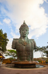 Half-body statue of Vishnu in the Garuda Wisnu Kencana complex in Bali Indonesia. In Hinduism, Vishnu is a god who is titled as shtiti, the maintainer of God's creation.