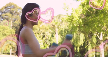 Exercising outdoors, woman with pink heart animation overlay, staying fit