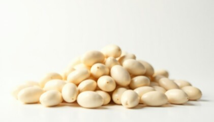 Pile of white beans against bright white backdrop, healthy food, cooking
