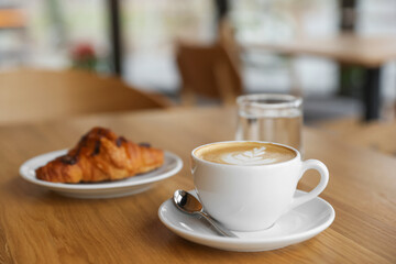 Delicious breakfast served on wooden table in cafe, closeup