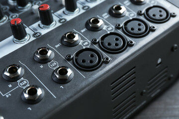 Professional mixing console on table, closeup. Radio studio equipment