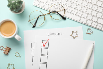 Checklist with marked checkbox, coffee, keyboard, glasses and paper clips on light blue background,...