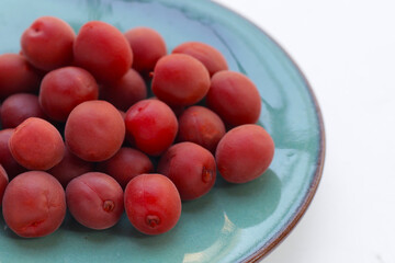Umeboshi, Japanese pickled plums, Sour and salty taste.