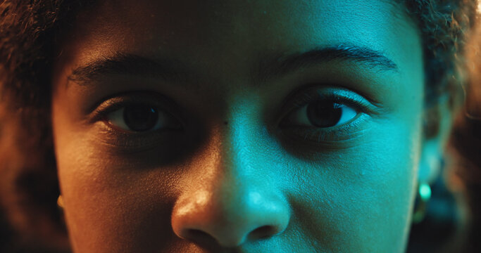 Portrait, neon and child with color, light and closeup of face, unique and artistic with glow or art deco. Fantasy, creative or person with vision for imagination, inspiration or perspective of magic