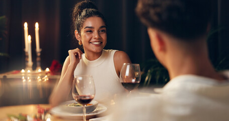 Couple, talking and red wine on date at restaurant on valentines day, romantic dinner and celebration. People, alcohol and cuisine meal of fine dining, anniversary bonding and relationship commitment