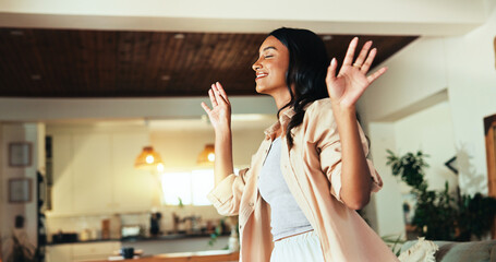 Woman, smile and dancing in home with music, relax and freedom in living room with energy in morning. Person, girl and happy with rhythm, excited and talent with moving body in lounge at apartment