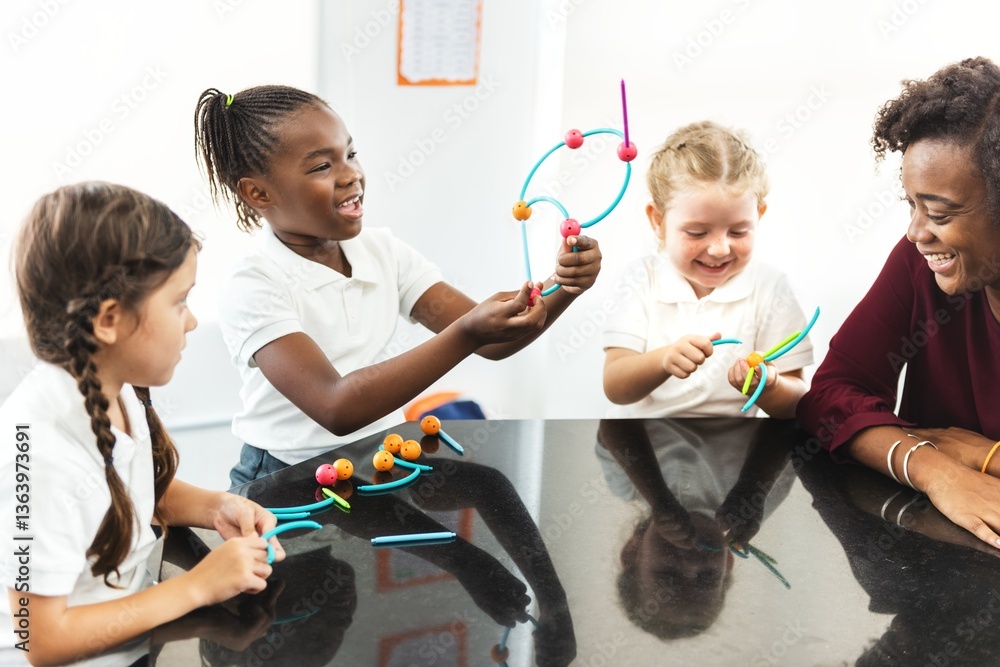 Poster Diverse elementary students and woman teacher engaging in a fun science activity with colorful models. Kids learning and playing with science models in a classroom. Happy elementary students in class.