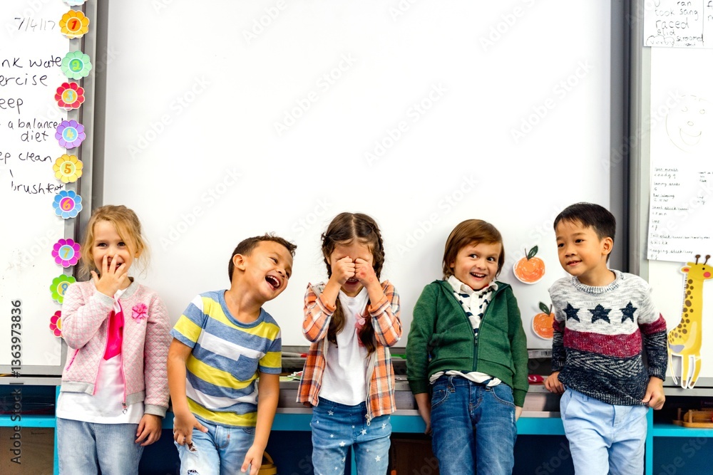 Poster group of diverse children laughing in a classroom. kids stand in front of a whiteboard, smiling and 