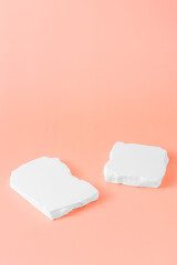 Abstract minimalist composition of white stone shapes on pastel background