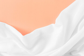 Elegant Draped Fabric on Soft Peach Background for Modern Design Projects