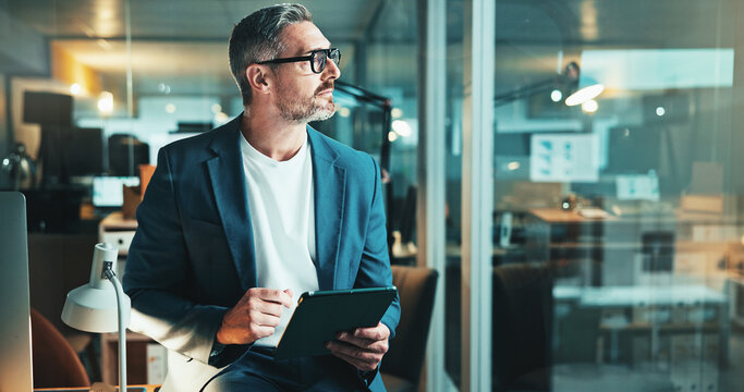 Night, thinking and man on tablet for office report, post deadline or online update research. Mature person, web design or content strategy for digital marketing trends or social media growth on tech