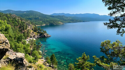 Panoramic View of a Turquoise Lake Surrounded by Lush Green Trees Under a Clear Blue Sky