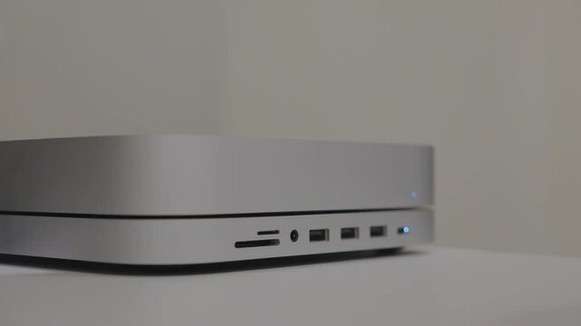 Seattle WA USA - March 13th 2025: insert usb drive into mac mini