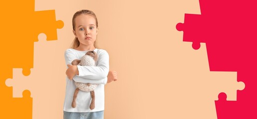 Sad little girl with autistic disorder holding toy on color background
