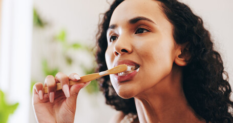 Bathroom, brushing teeth and woman with toothbrush in home for dental care, mouth hygiene and...