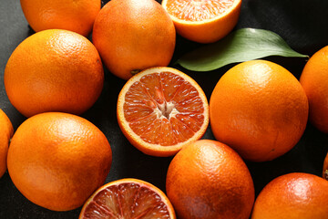 Tasty blood orange fruits on dark background