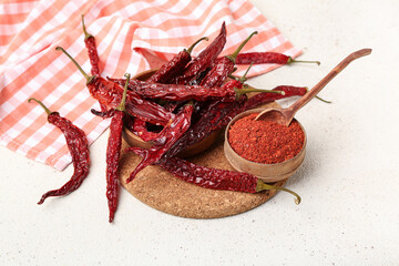 Composition with dry hot chili peppers and spices on white background