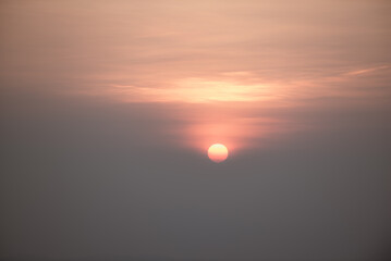 Obraz premium The first light of the day from the sun on the top of a high mountain.