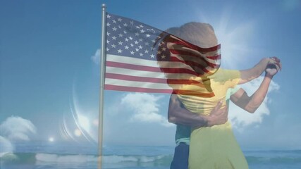 Embracing on beach, couple with American flag overlay in bright sunlight