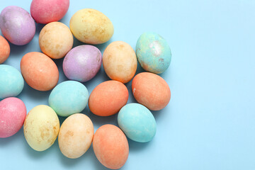 Painted Easter eggs on blue background