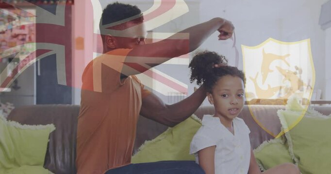 Styling daughter's hair, father at home with British flag animation overlay