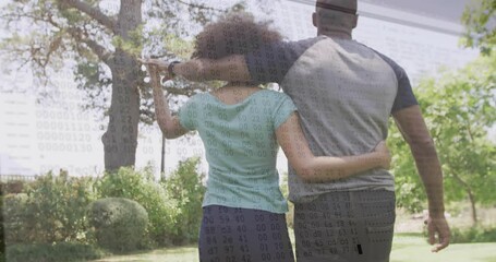 Embracing outdoors, couple with data processing animation overlay in background - Powered by Adobe