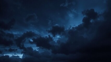 Obraz premium Black blue evening night sky with clouds. Dark dramatic sky background. Before the storm, thunderstorm, rain. Frightening, ominous, moody, creepy atmosphere.
