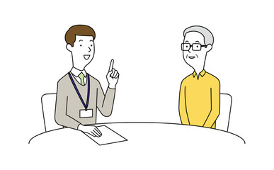 男性の相談員にアドバイスを聞く高齢の男性