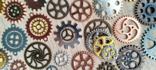 Industrial gears in close-up workshop photography textured background top-down view mechanical artistry