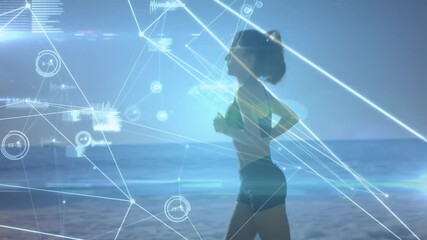 Jogging on beach, woman surrounded by digital data network animation overlay - Powered by Adobe