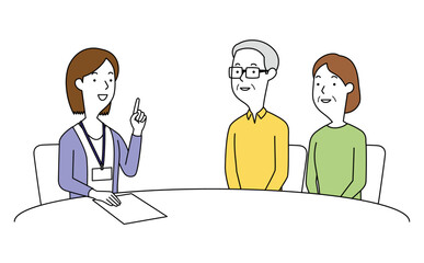 女性の相談員にアドバイスを聞く高齢の男女