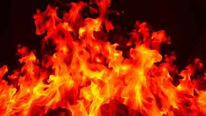 Fototapeta premium Energetic display of vibrant fire blazing against a dark backdrop creating dramatic effect