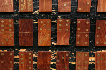 Texture of dominos blocks on black wooden background